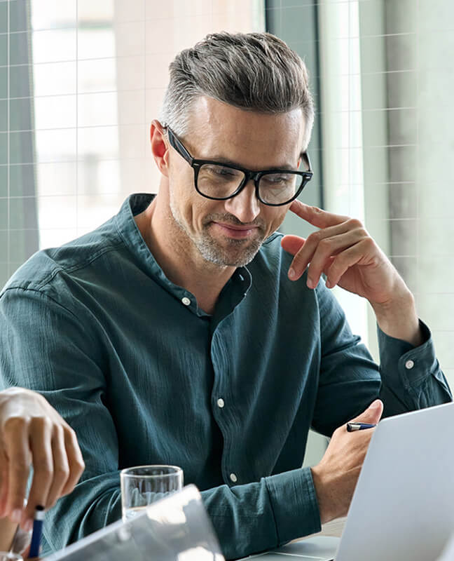 Sales professional using a laptop